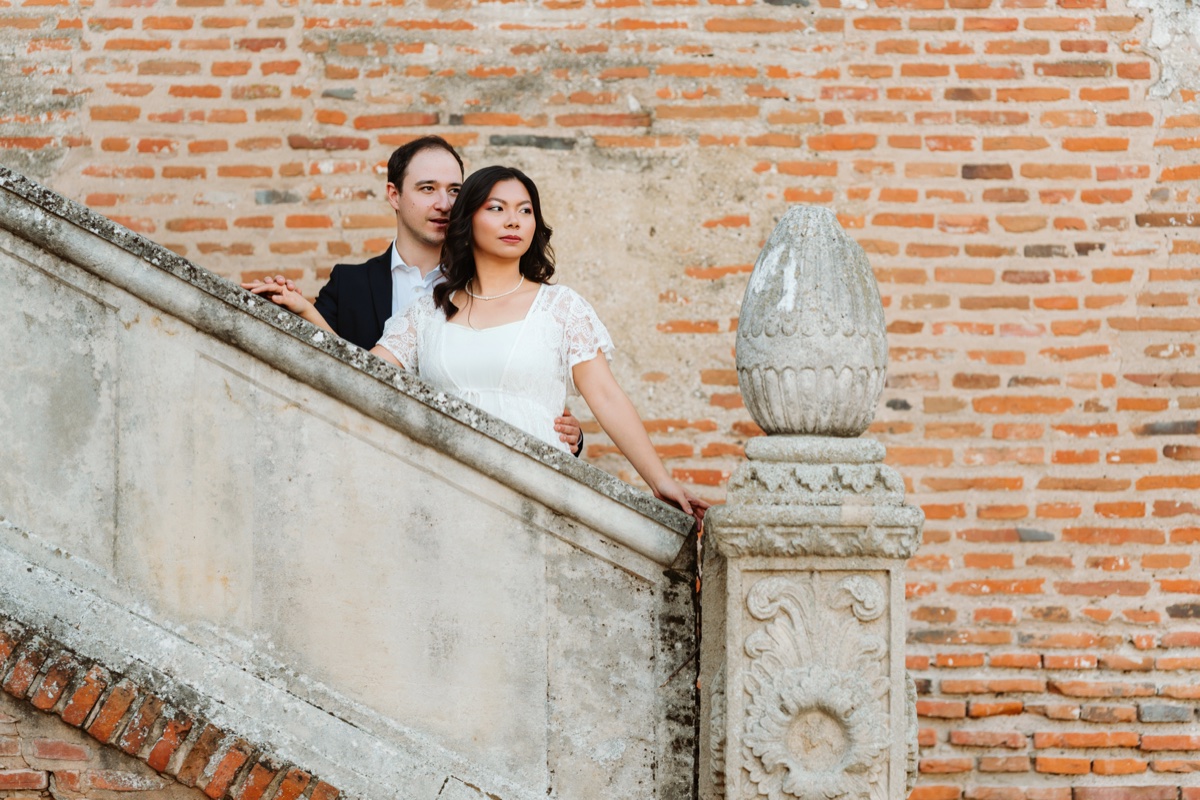 Elegant couple on stone staircase