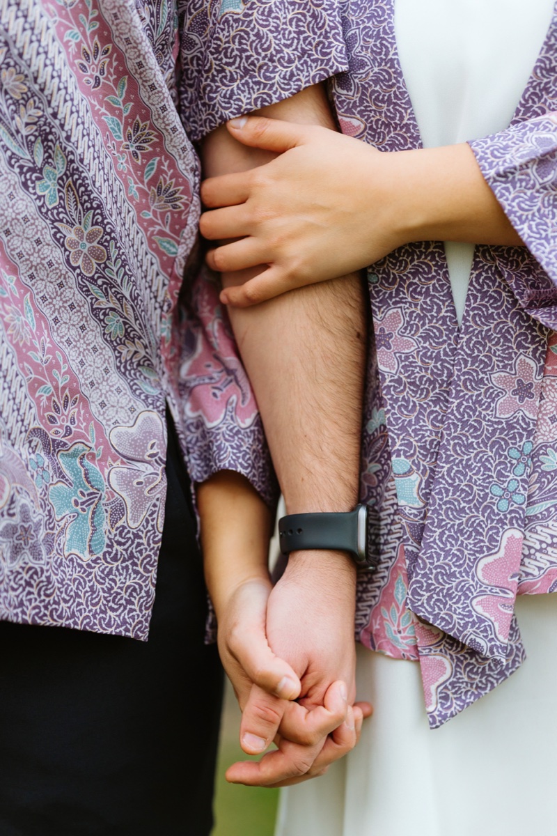 Intimate detail of Ludovico and Fidelia holding hands