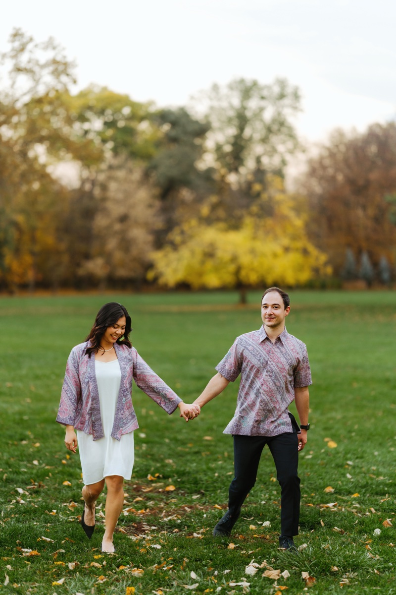 Ludovico and Fidelia holding hands in autumn park